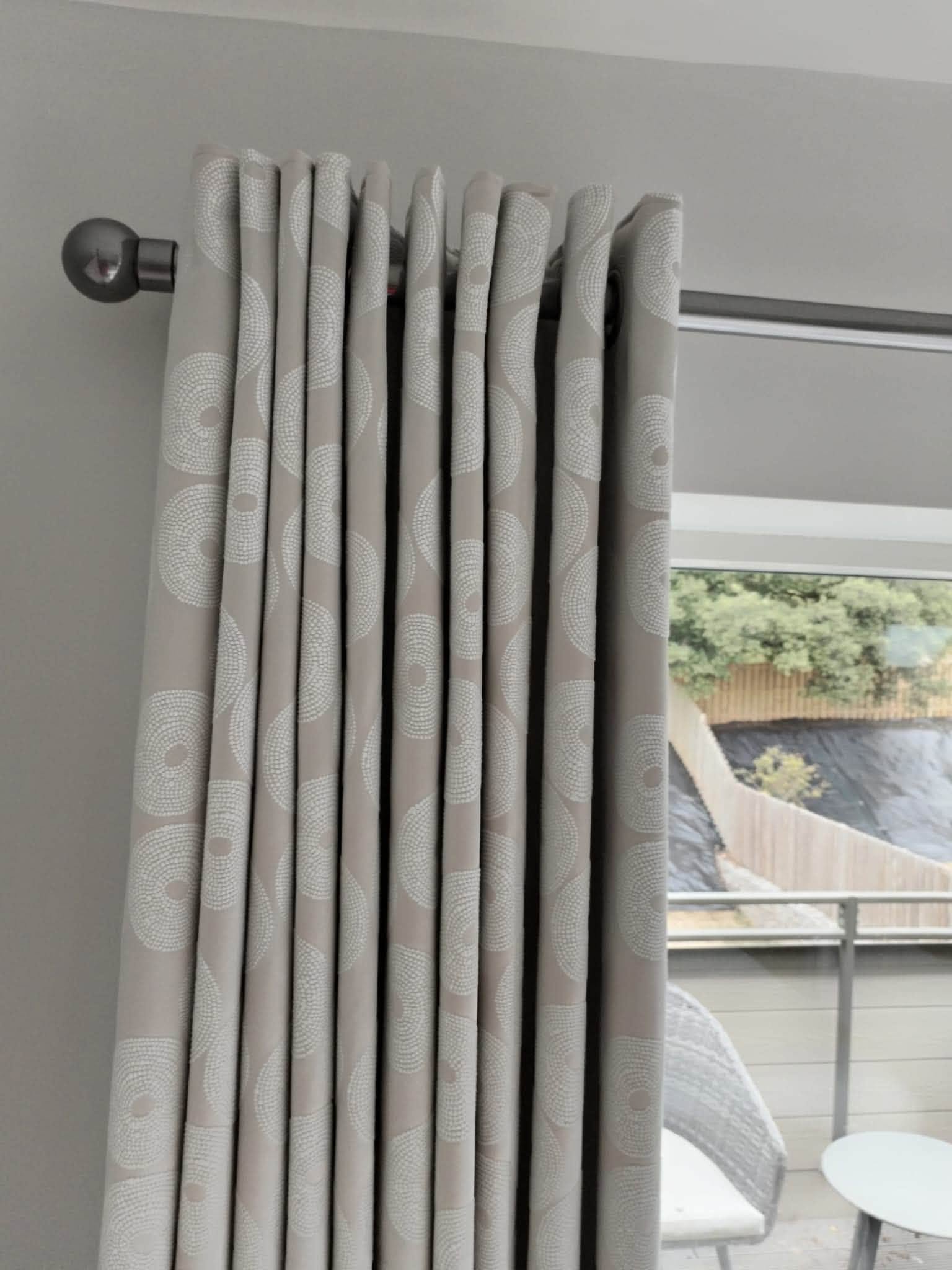 Close-up of a professionally fitted curtain and pole