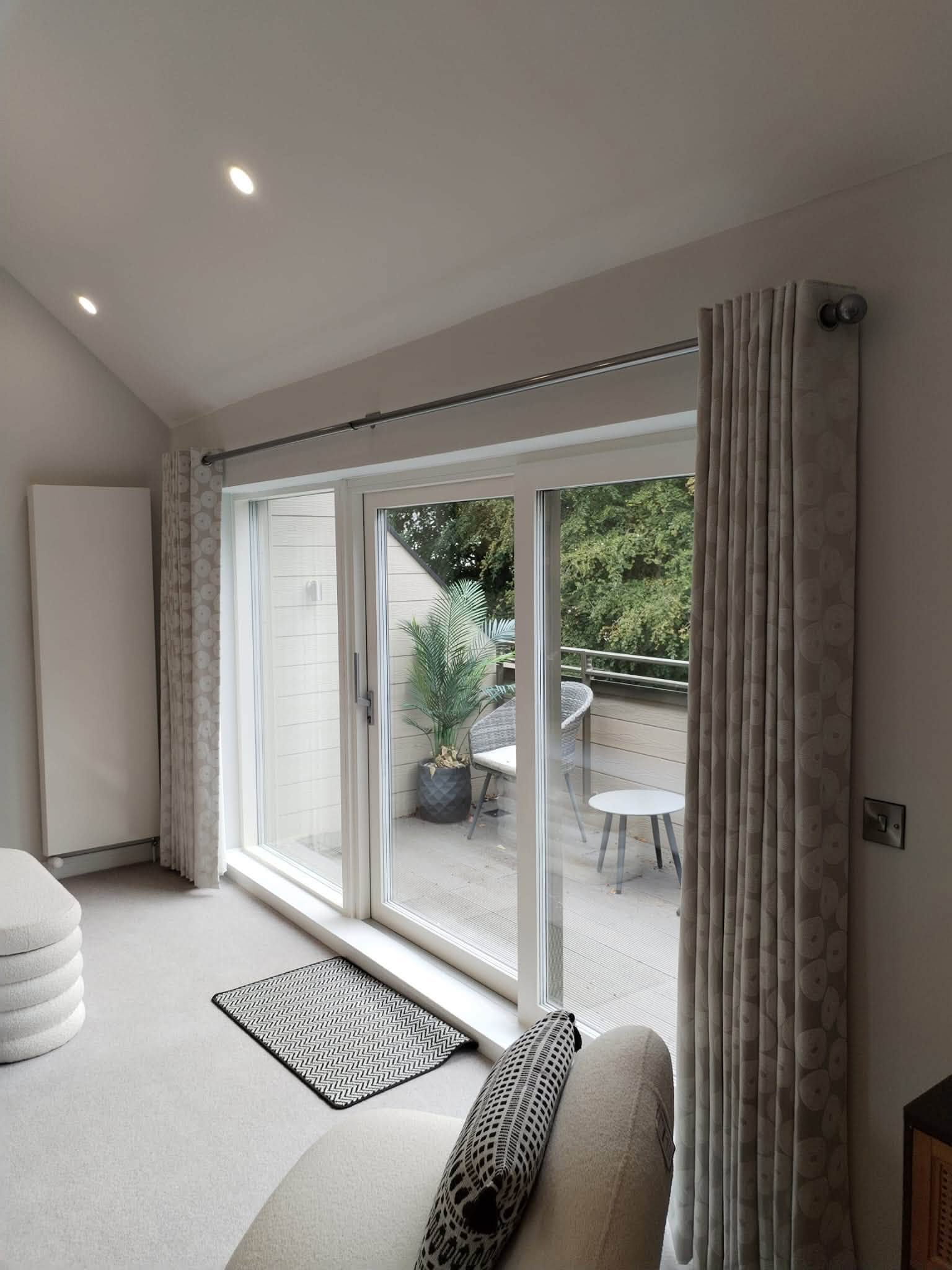 Made-to-measure curtains fitted across wide patio doors